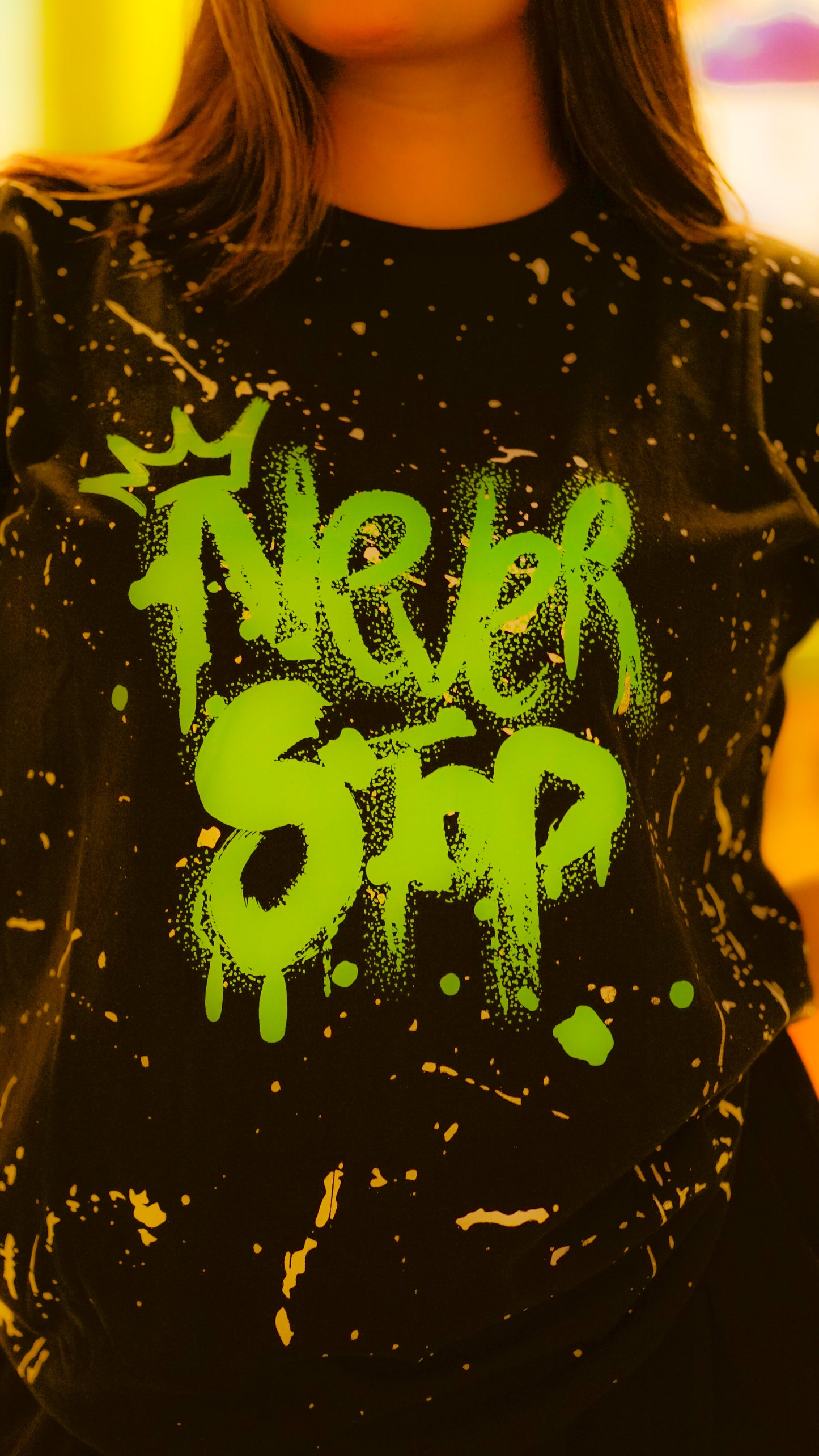 "NEVER STOP" Oversized Streetwear T-Shirt – All-Over Splatter Print (Black)